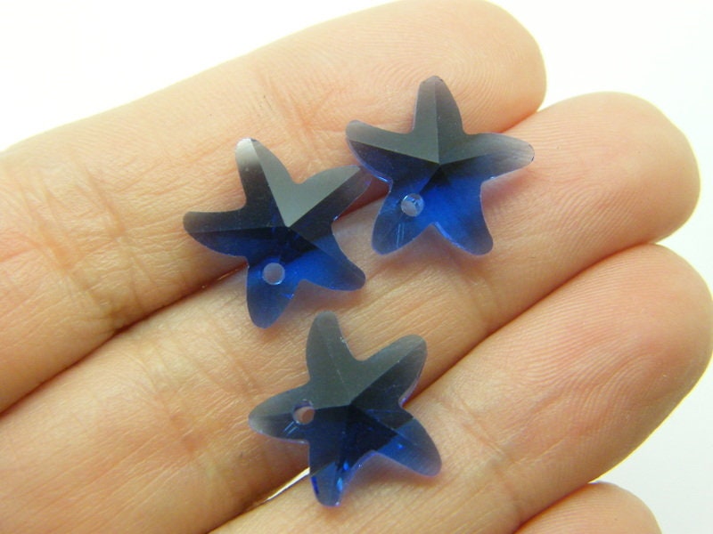 10 Starfish charms dark blue glass FF571