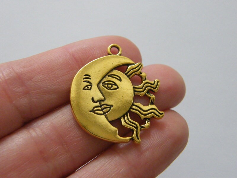 6  Moon and sun pendants antique gold tone M135