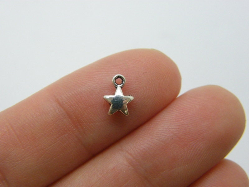 30 Star charms antique silver tone S407