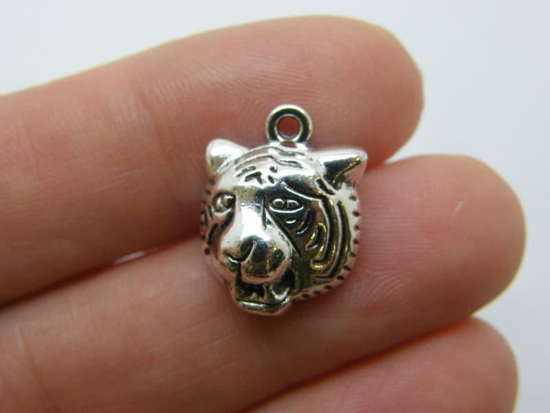 8 Tiger charms antique silver tone A1417
