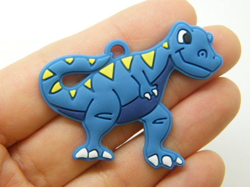 8 Dinosaur pendants  blue PVC plastic A866