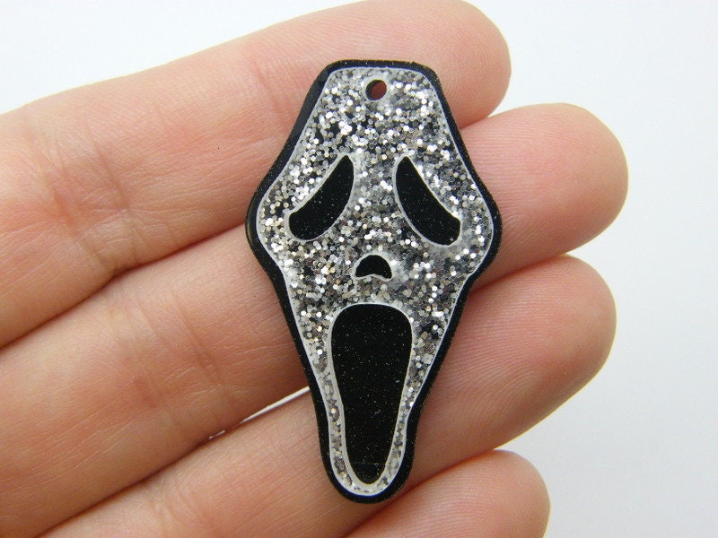 2 Skull pendants glitter clear black  acrylic HC138