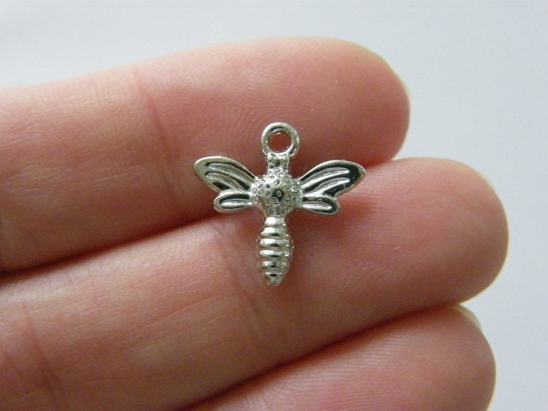10 Bee charms silver tone A609