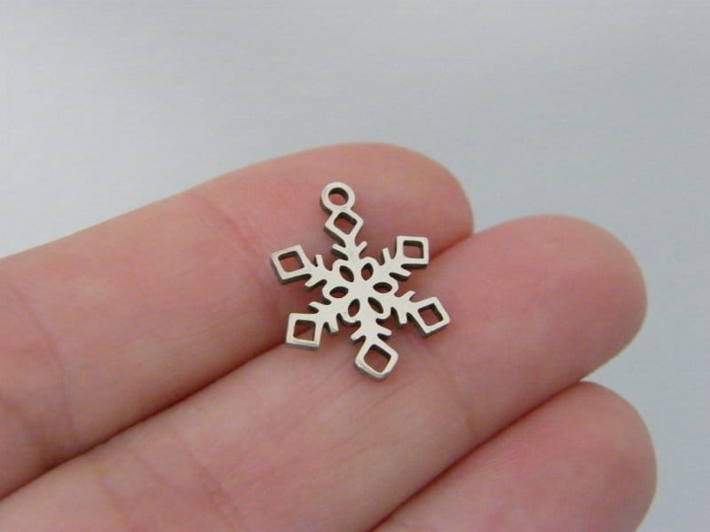 2 Snowflake charms silver tone stainless steel SF24