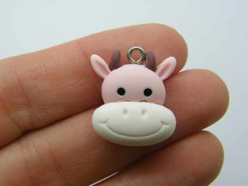 8  Cow face charms pink resin A535