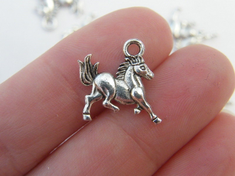 12 Horse charms tibet silver A600