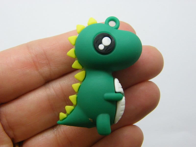 4 Dinosaur pendants green PVC plastic 08A