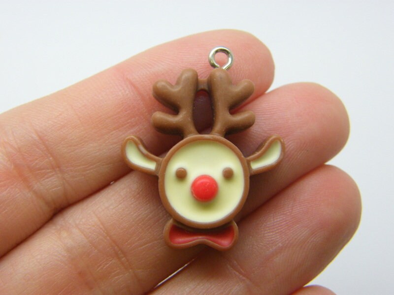 4 Reindeer Christmas charms brown resin CT392