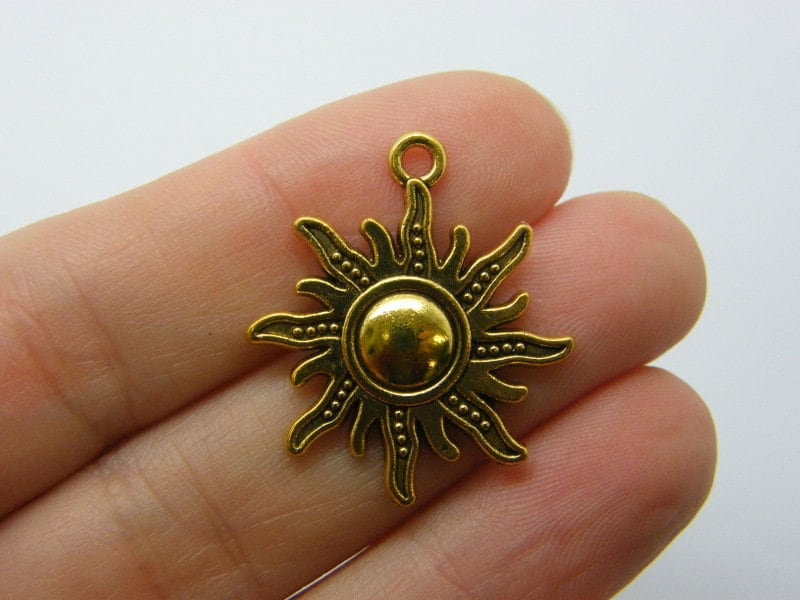 6 Sun pendants antique gold tone S136