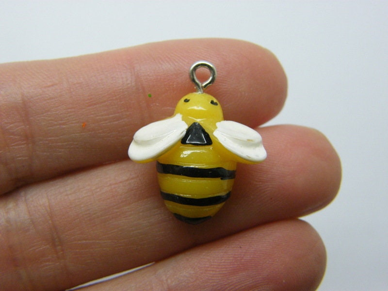 4 Bee charms yellow black white resin A238