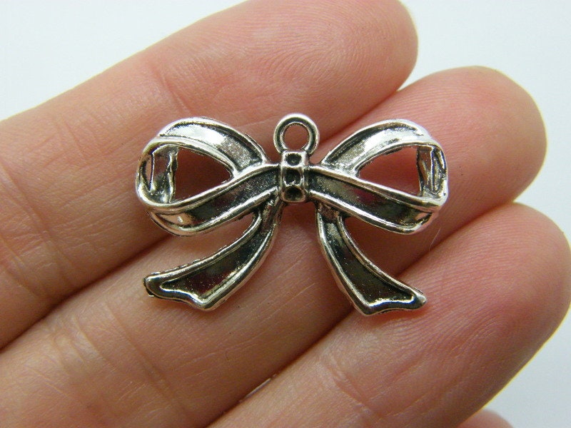 6 Bow charms antique silver tone CT49