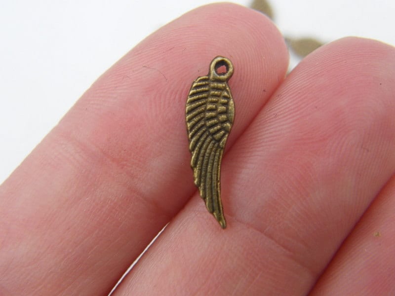 24 Angel wing  charms antique bronze tone AW81