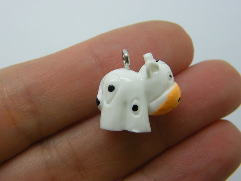 6 Cow charms white resin A1238