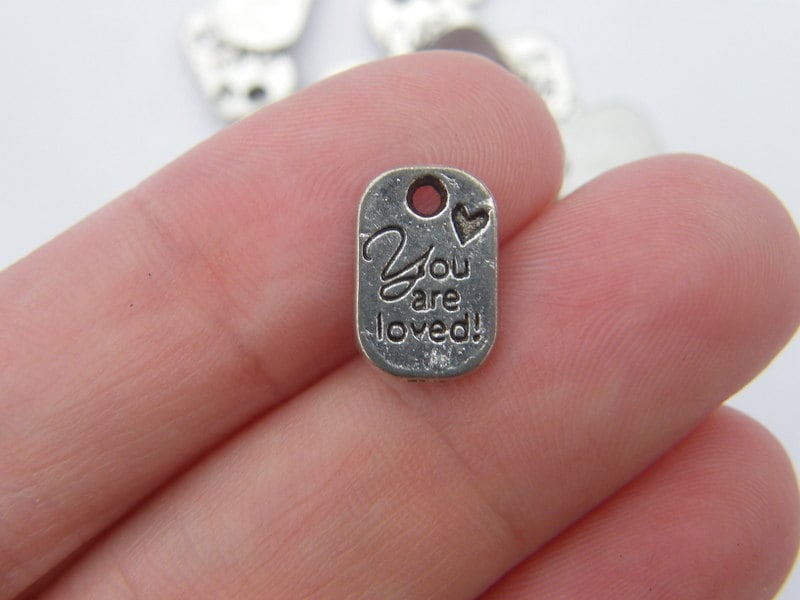 BULK 50 You are loved charms antique silver tone M39