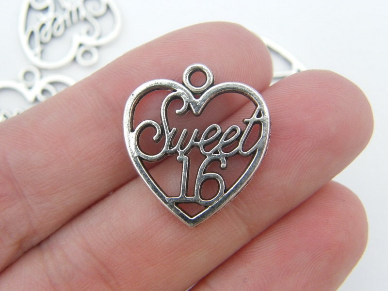 10 Sweet 16 heart pendants antique silver tone H2