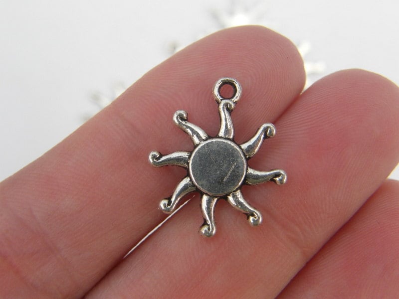 10 Sun charms antique silver tone S61