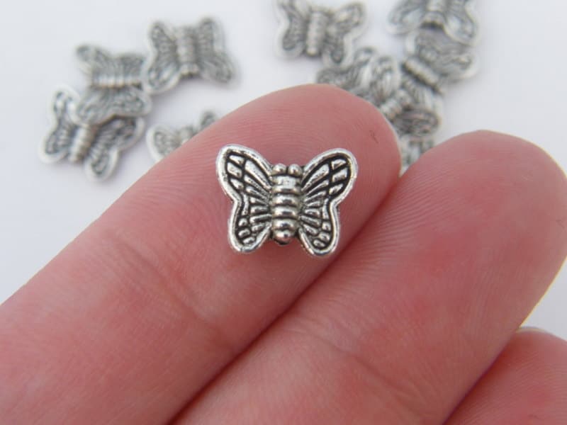 14 Butterfly spacer beads antique silver tone A338