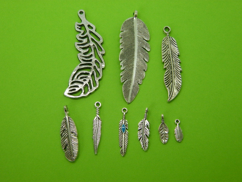The Feather Collection - 9 antique silver tone charms