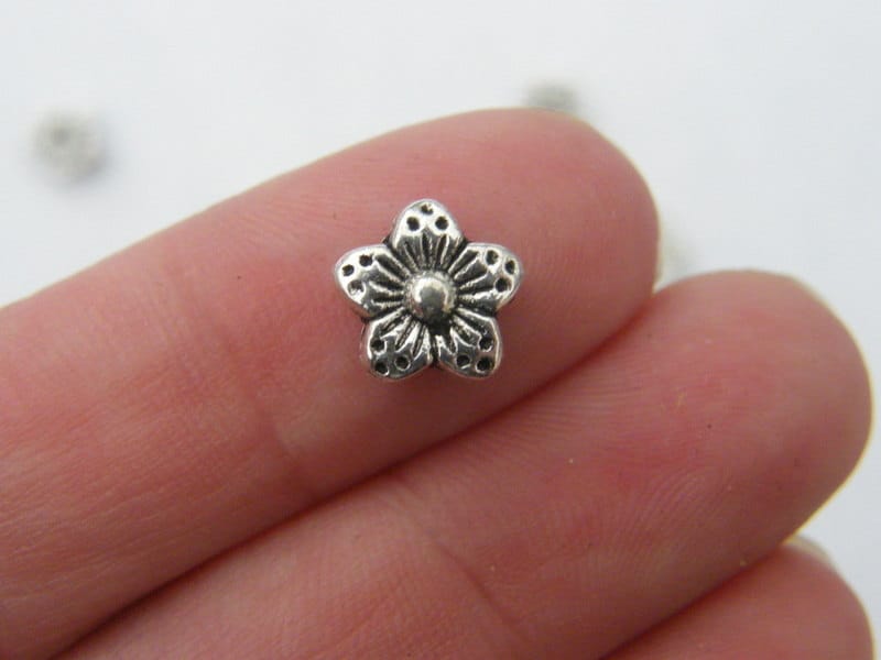 16 Flower spacer beads antique silver tone F131