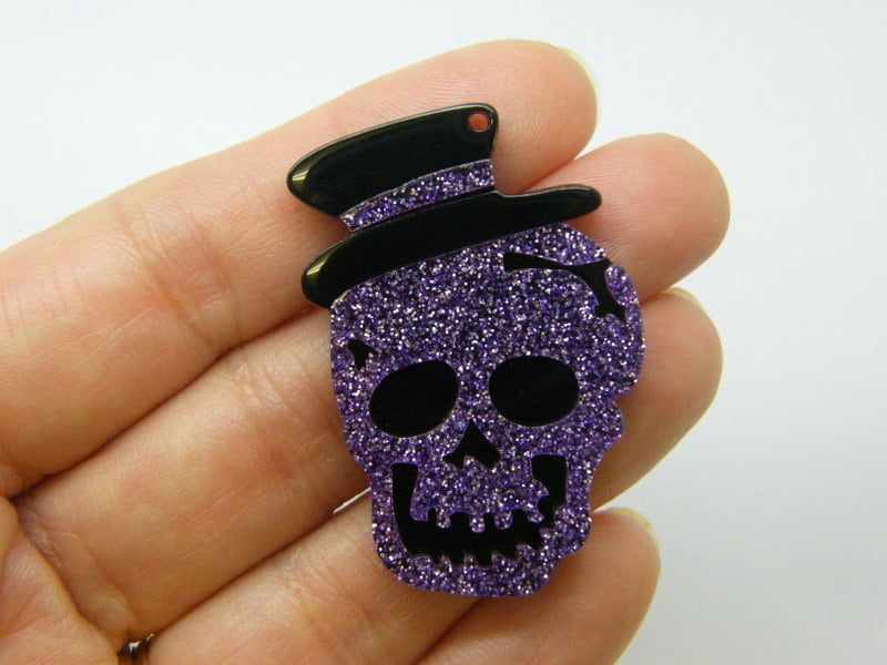 2 Skull pendants purple glitter and black  acrylic HC955
