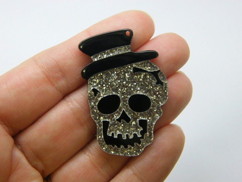 2 Skull pendants silver glitter and black  acrylic HC529