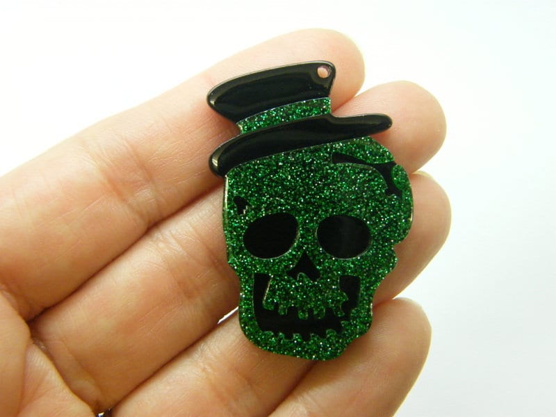 2 Skull pendants green glitter and black  acrylic HC302