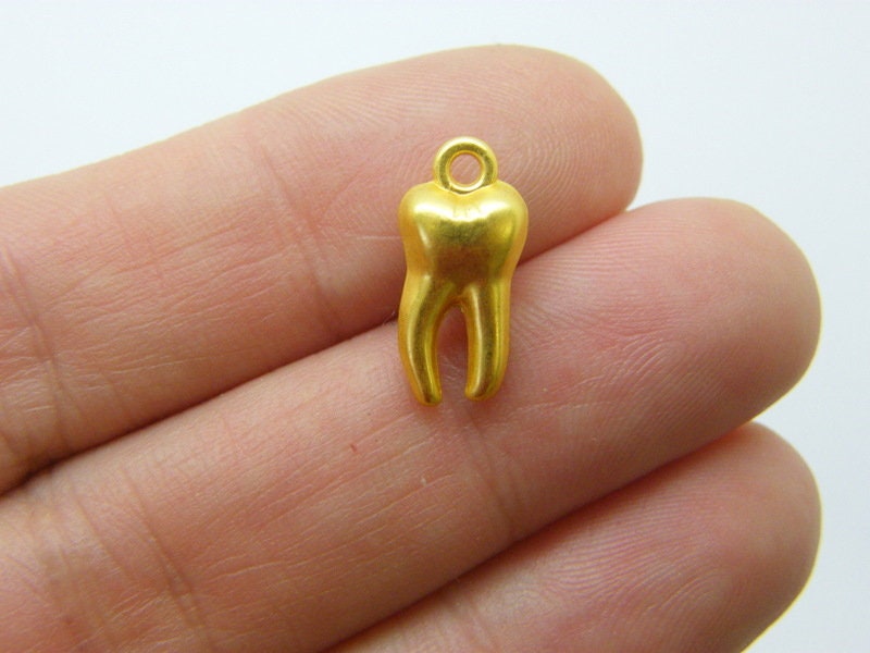4 Tooth charms gold tone MD37