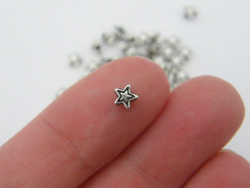 100 Star  spacer beads antique silver tone S22