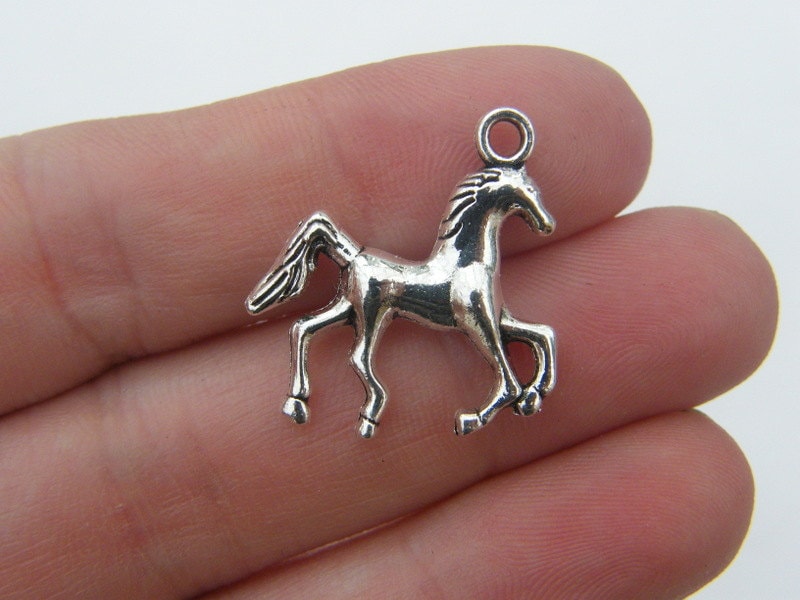 8 Horse charms antique silver tone A603