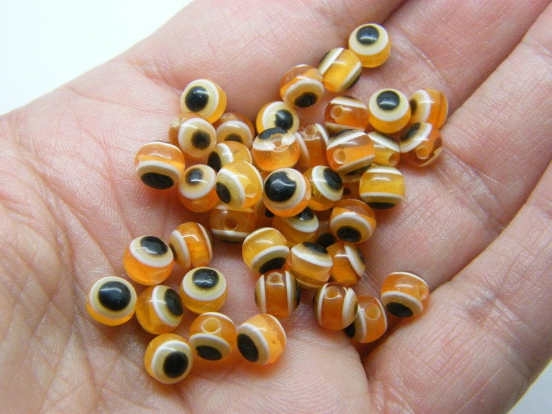 100 Evil eye 6mm beads orange white black resin AB43