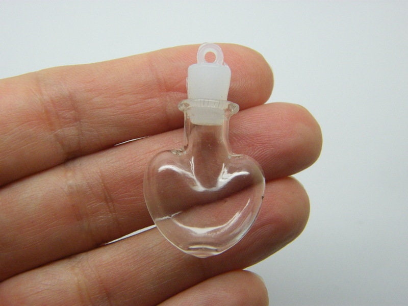 4 Mini glass bottle pendants with plastic lids M A
