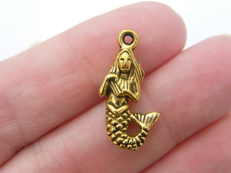 8 Mermaid charms antique gold tone FF634