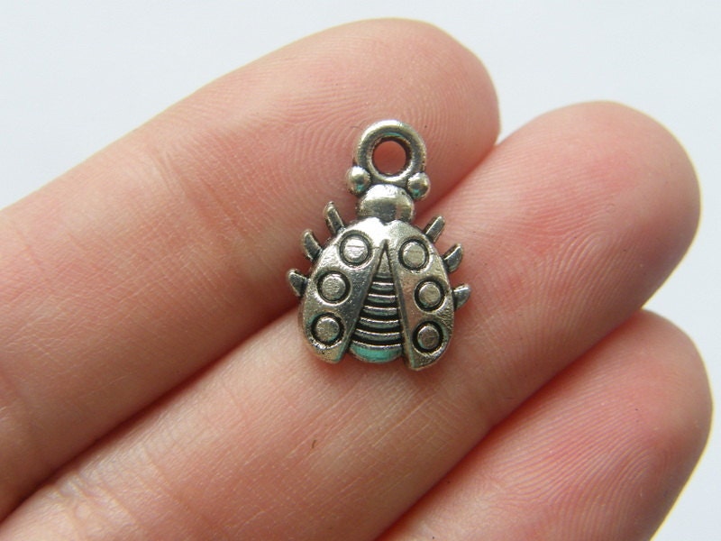 10 Ladybug charms antique silver tone A130