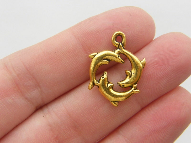 8 Dolphin charms antique gold tone FF82