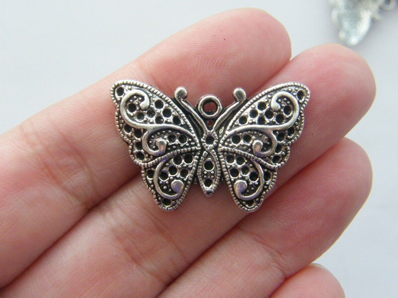 4 Butterfly charms antique silver tone A351