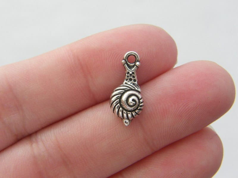 12 Sea snail charms antique silver tone A201