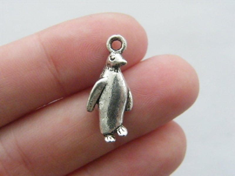 6 Penguin charms antique silver tone A170