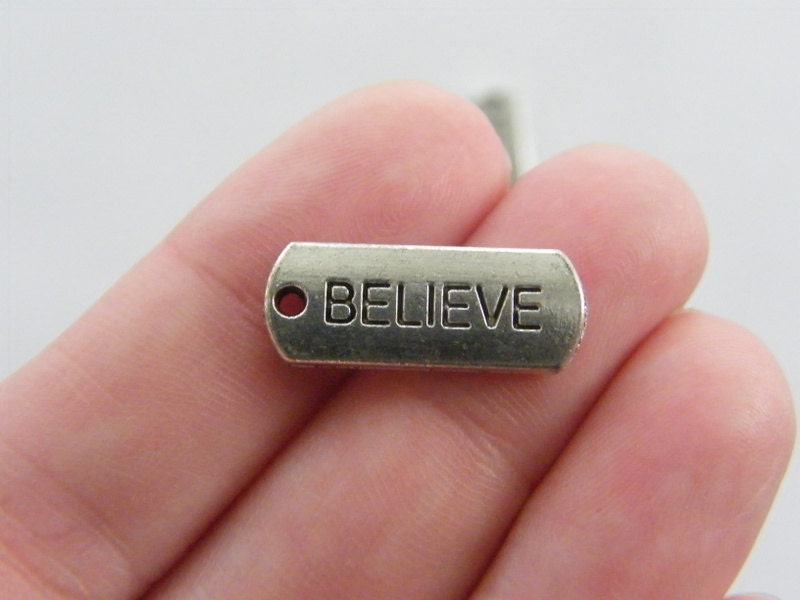 10 Believe charms antique silver tone M47