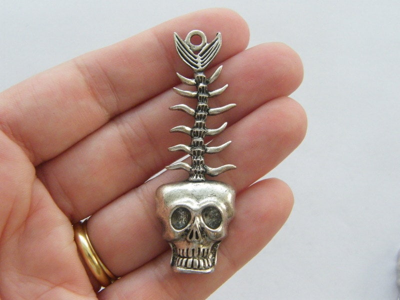 2 Skull fish bone charms antique silver tone HC239