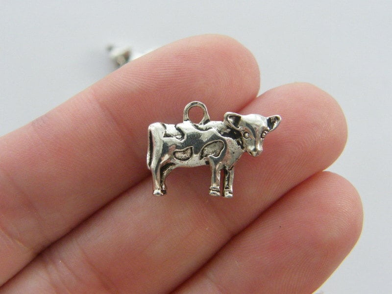 4 Cow charms antique silver tone A112