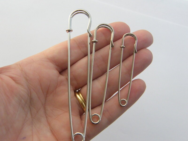 3 Safety pin brooches silver tone fS164