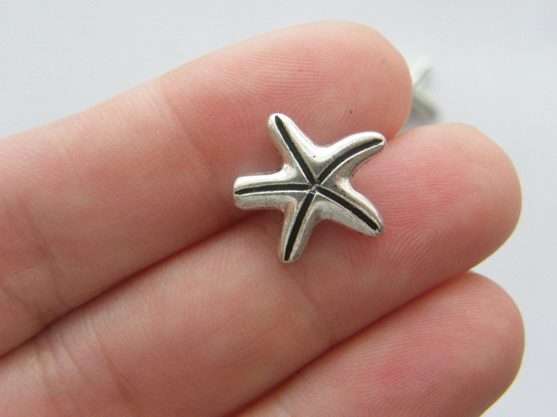 8 Starfish spacer beads antique silver tone FF225