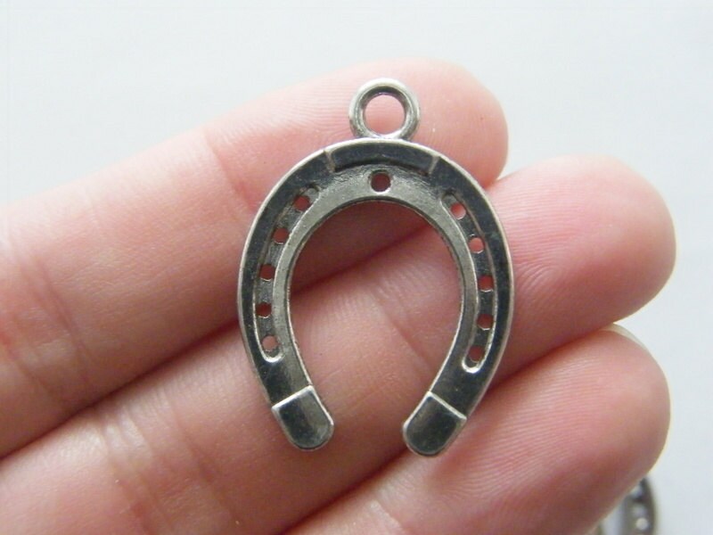 8 Horseshoe pendants  antique silver tone A551