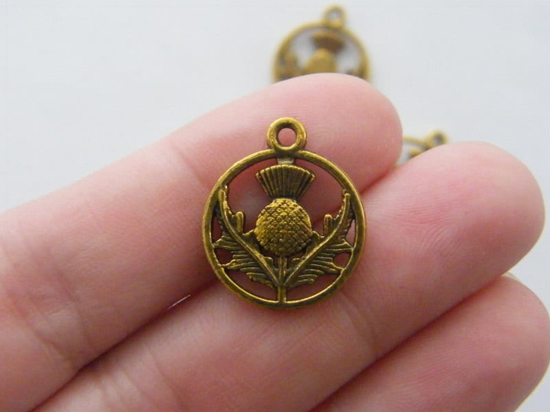 12 Thistle charms antique gold tone F67