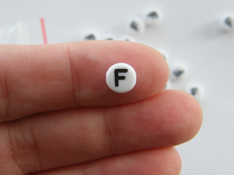 100 Letter F acrylic round alphabet beads white and black
