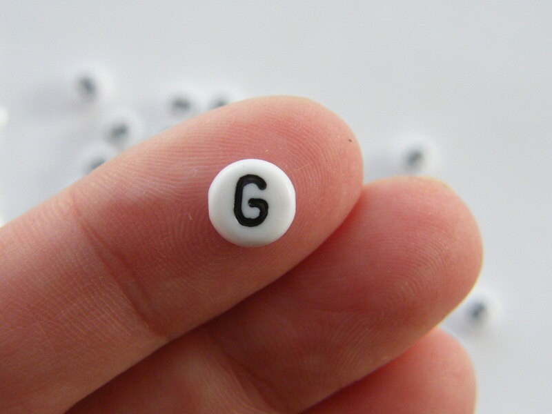 100 Letter G acrylic round alphabet beads white and black