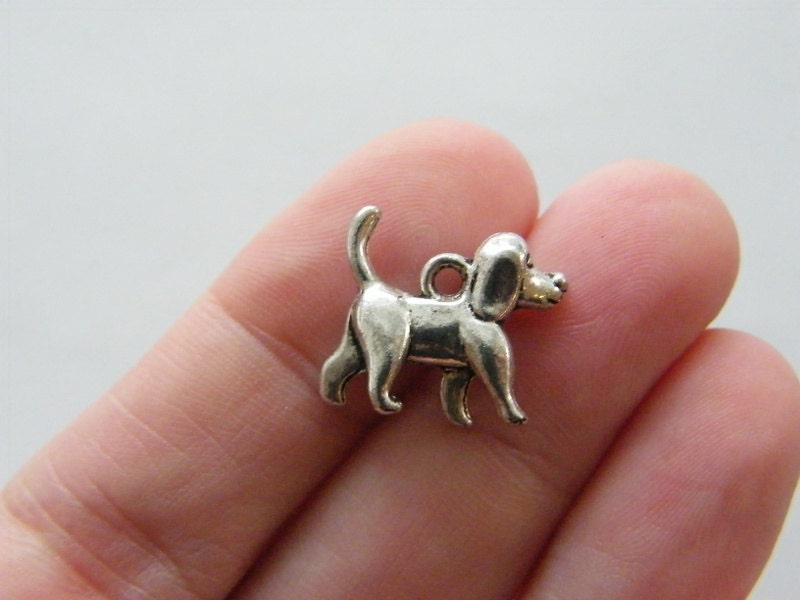 8 Dog charms antique silver tone A897