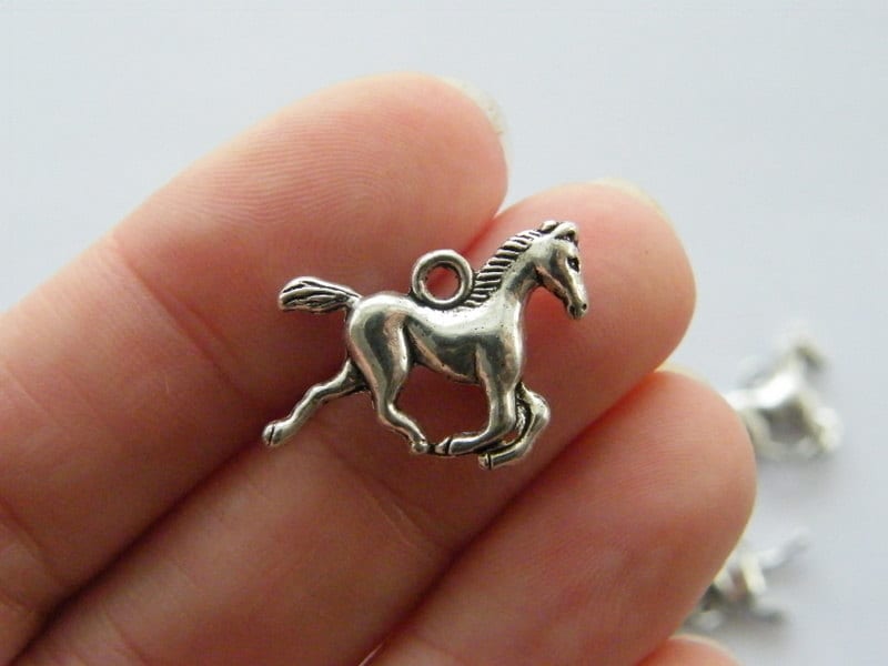 10 Horse charms antique silver tone A589