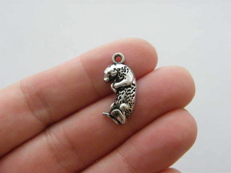 4 Otter charms antique silver tone A106