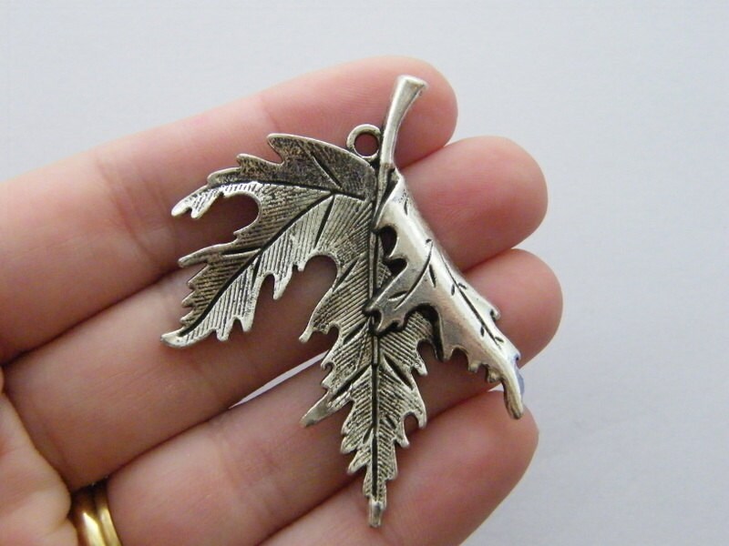 2 Leaf charms antique silver tone L112